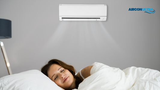 Lady sleeping in the bedroom with air conditioning unit running in the background